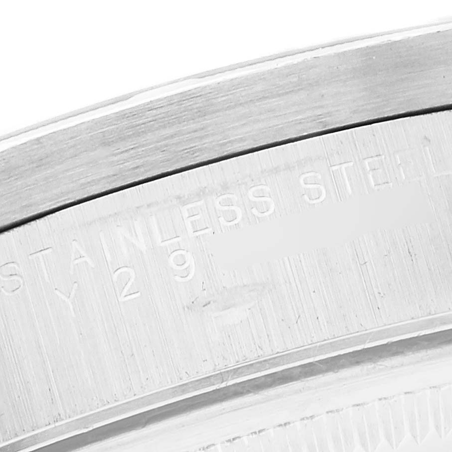 This is a close-up angle of the case back, showing the "STAINLESS STEEL" engraving of the Rolex Air-King 14010 Men's Stainless Steel Pink Dial 14010 Men's Stainless Steel Pink Dial watch.