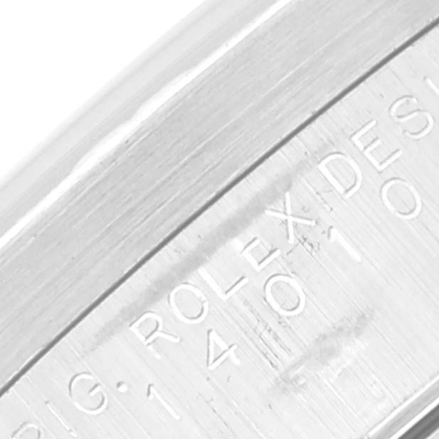 The image shows a close-up angle of the Rolex Air-King 14010 Men's Stainless Steel Pink Dial 14010 Men's Stainless Steel Pink Dial model, specifically highlighting the engraving on the case.
