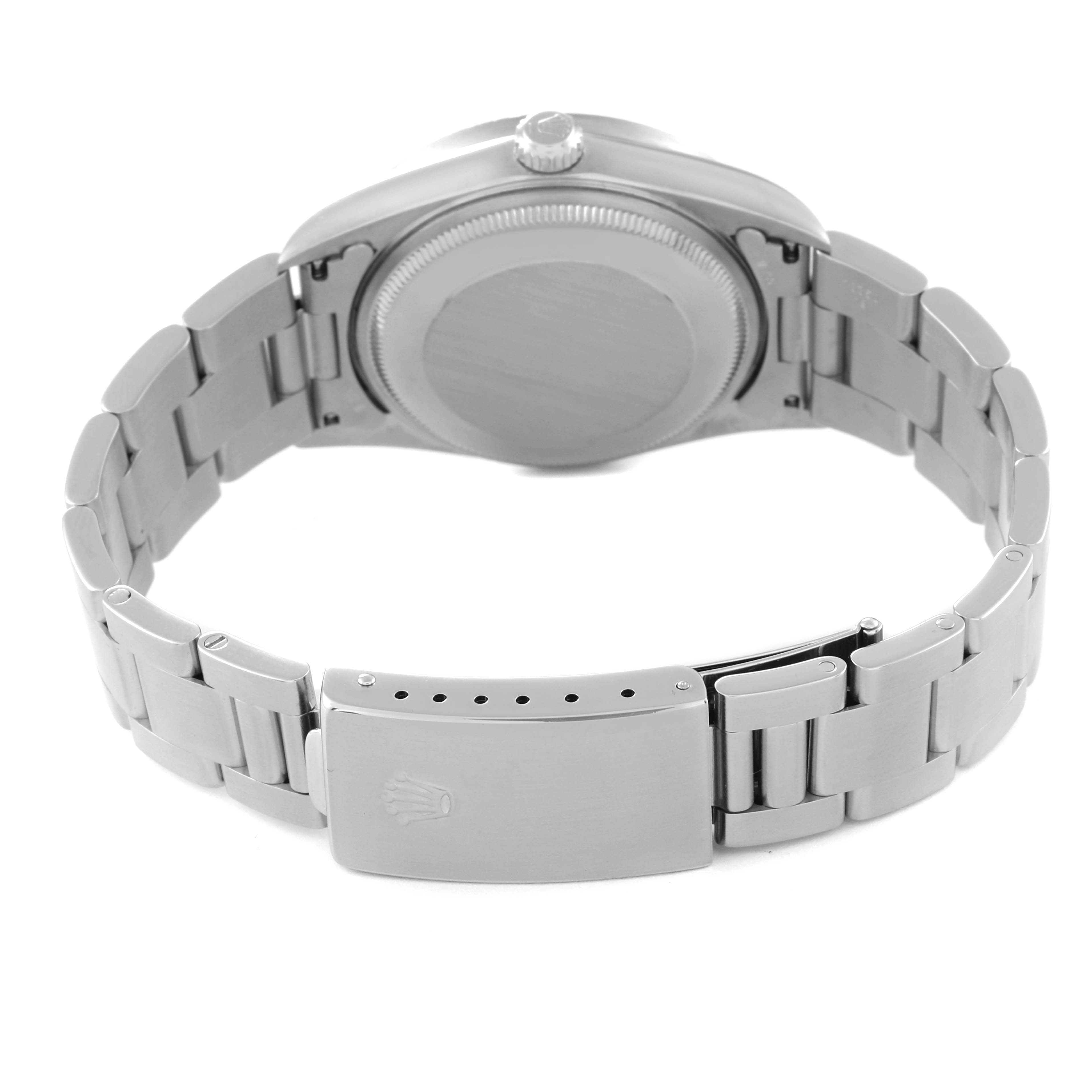 This image shows the backside and bracelet of a Rolex Air-King 14010 Men's Stainless Steel Pink Dial 14010 Men's Stainless Steel Pink Dial watch.