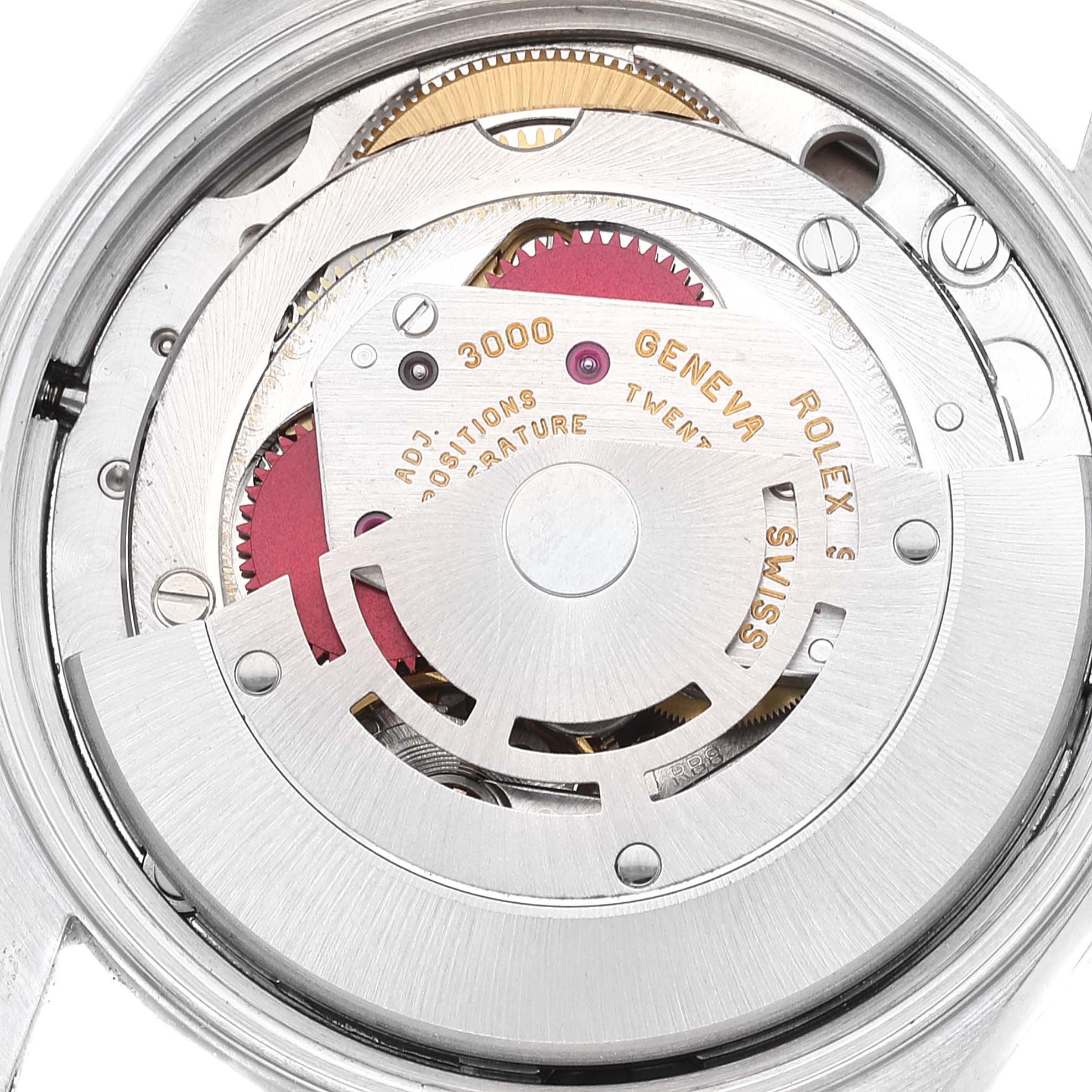 This image shows a close-up view of the movement inside a Rolex Air-King 14010 Men's Stainless Steel Pink Dial 14010 Men's Stainless Steel Pink Dial watch, highlighting its intricate components and engravings.