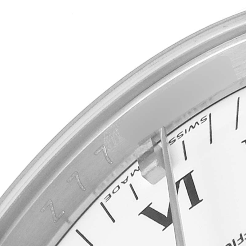 This image shows a close-up of the dial and bezel of a Rolex Air-King 114200 Men's Stainless Steel White Dial 114200 Men's Stainless Steel White Dial watch, highlighting the Roman numeral hour marker and part of the second hand.