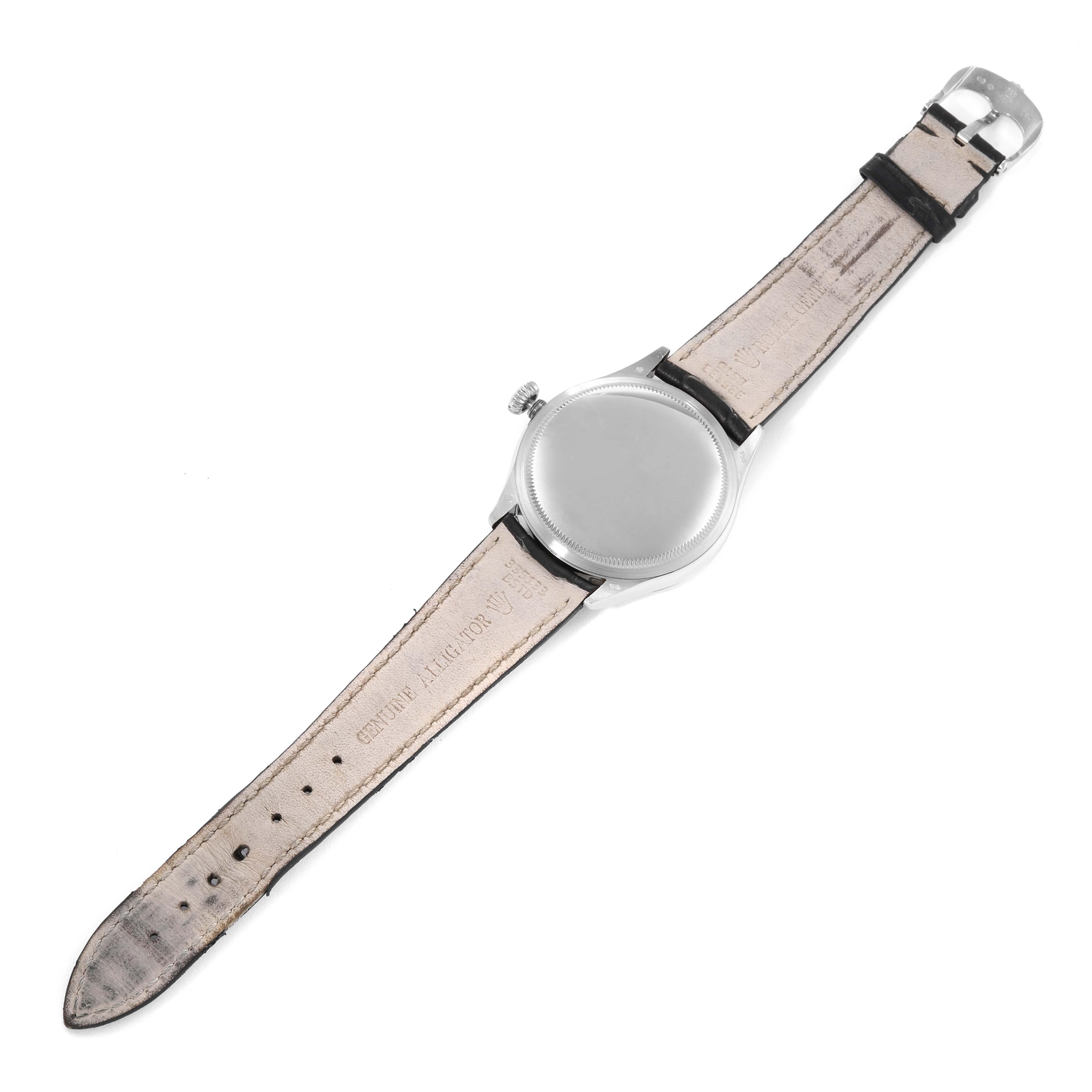 This image shows the back view of a Rolex Cellini 50509 Men's White Gold White Dial 50509 Men's White Gold White Dial watch, displaying its case back, leather strap, and buckle.