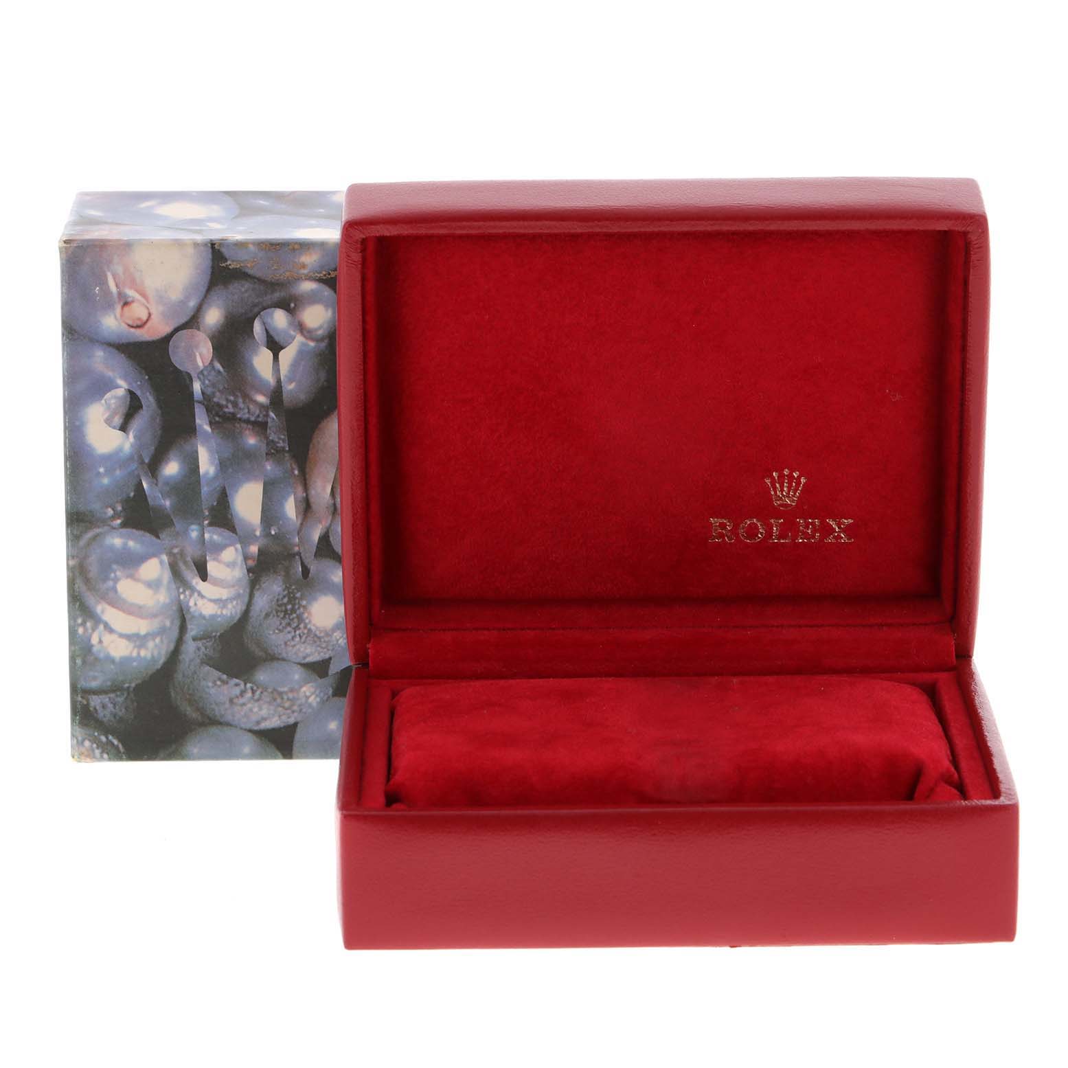 This image shows an empty red Rolex watch box, likely for a Rolex Date 69190 Women's Stainless Steel Grey Dial 69190 Women's Stainless Steel Grey Dial model, with its outer decorative packaging in the background.