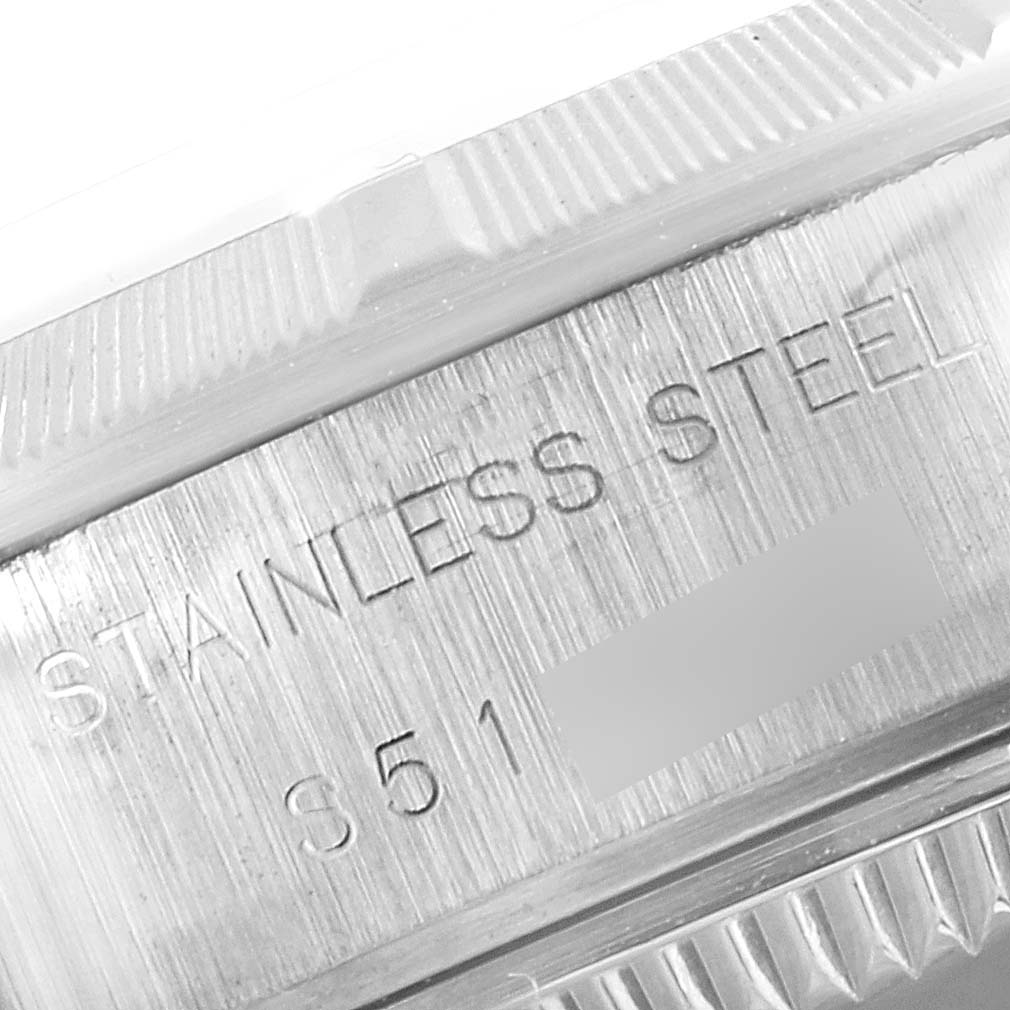 The image shows a close-up of a stainless steel section of the Rolex Date 69190 Women's Stainless Steel Grey Dial 69190 Women's Stainless Steel Grey Dial model watch, including part of the bezel and case back.