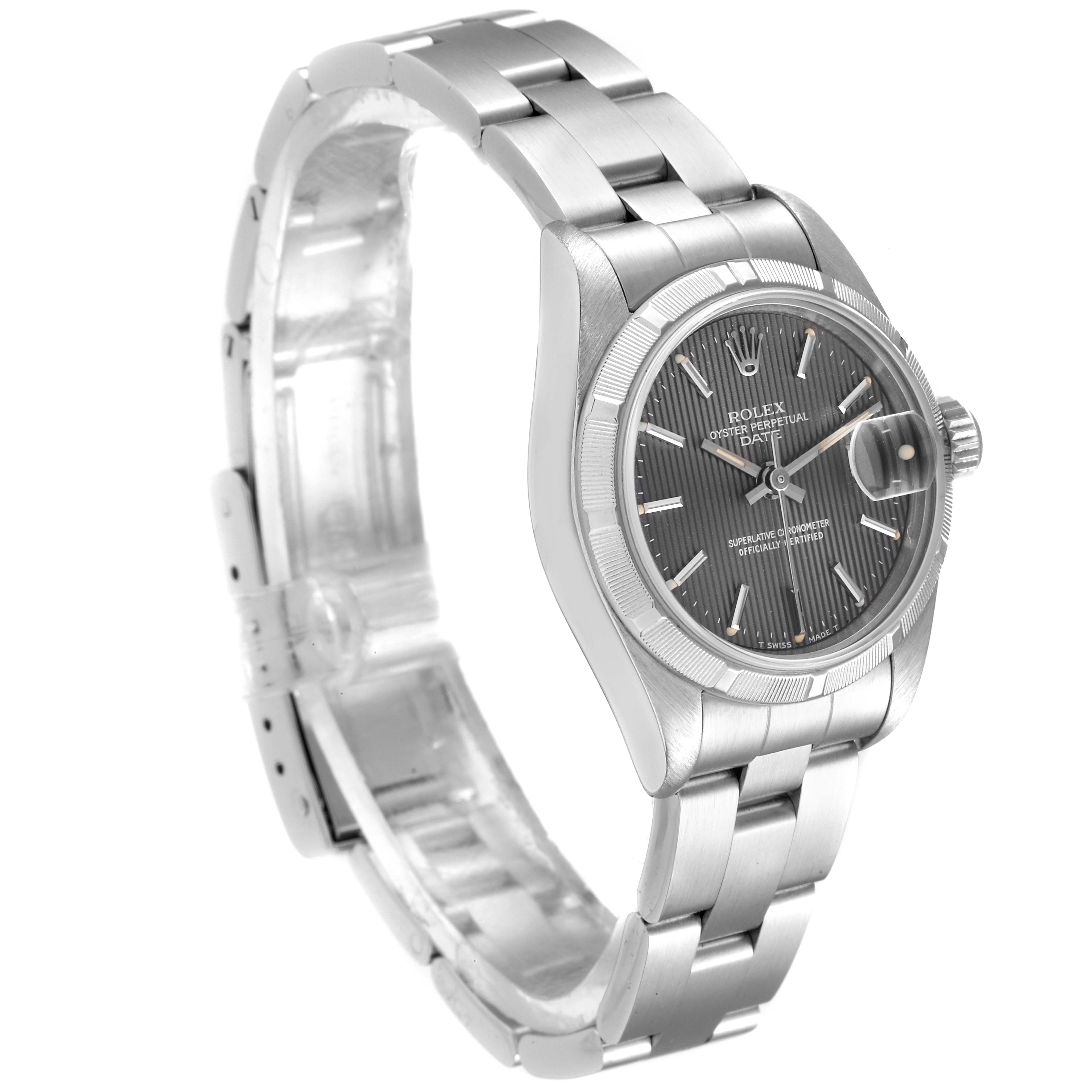 The Rolex Date 69190 Women's Stainless Steel Grey Dial 69190 Women's Stainless Steel Grey Dial watch is shown at an angle displaying its face, side, and part of its bracelet.