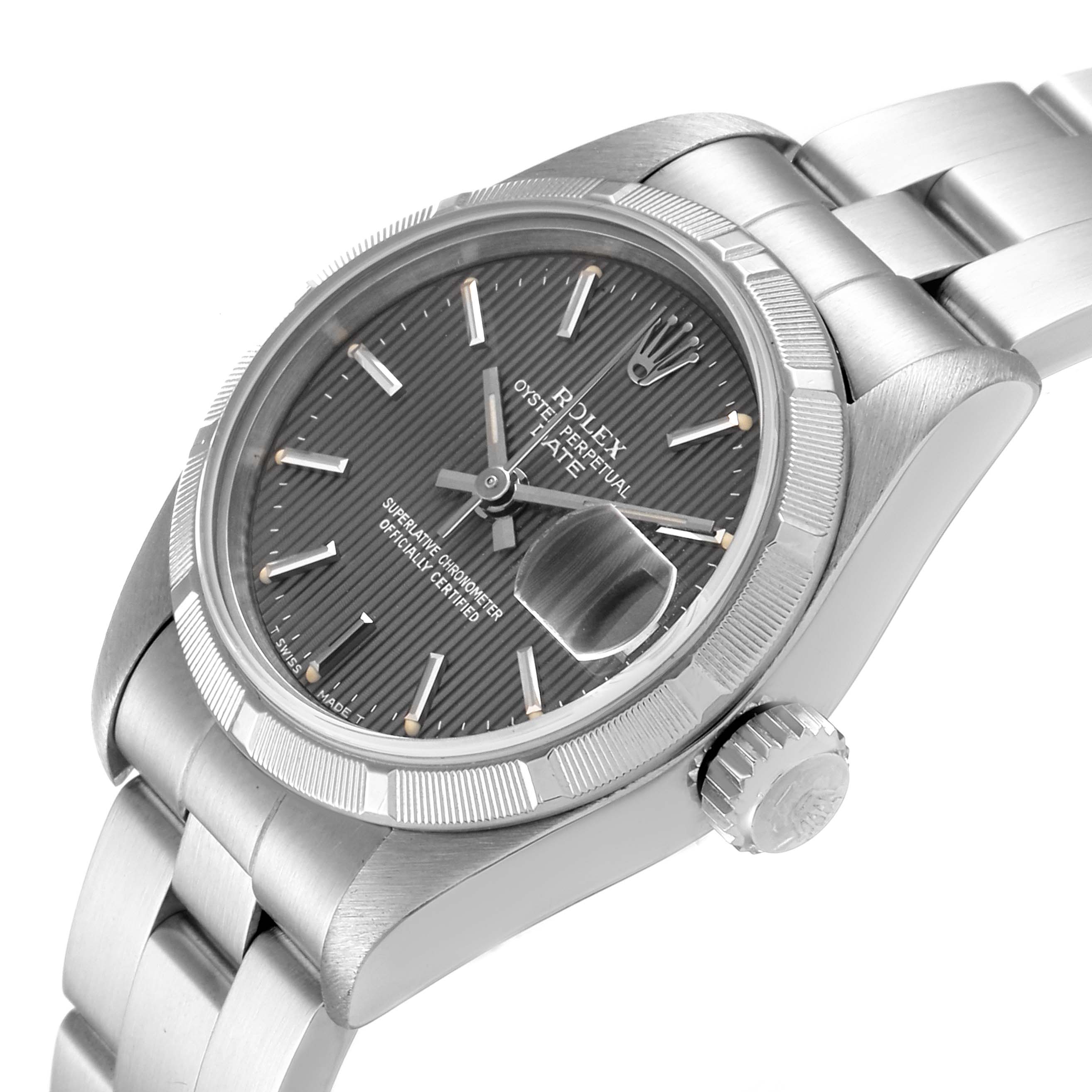The image shows a Rolex Date 69190 Women's Stainless Steel Grey Dial 69190 Women's Stainless Steel Grey Dial model watch from an angled side view, highlighting the dial, bezel, crown, and bracelet.