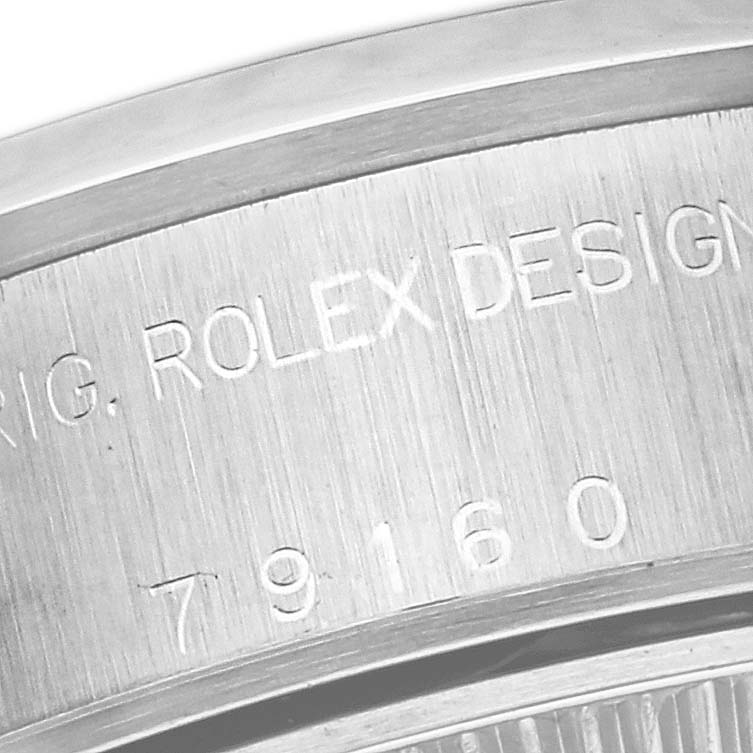 This image shows a close-up of the engraved case back of a Rolex Date 79160 Women's Stainless Steel Silver Dial 79160 Women's Stainless Steel Silver Dial model watch.