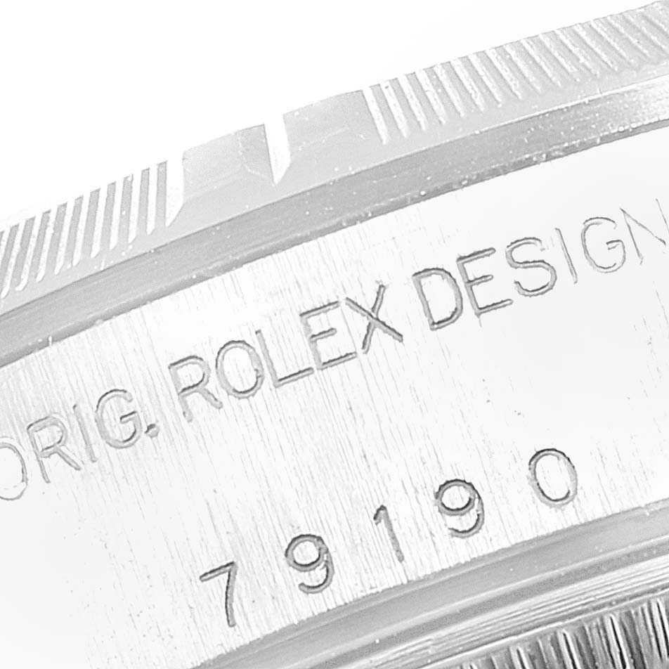 This image shows a close-up of the case side engraving on a Rolex Date 79190 Women
s Stainless Steel White Dial 79190 Women
s Stainless Steel White Dial model watch.