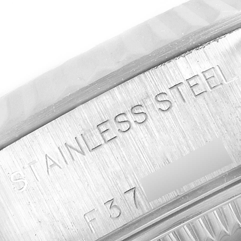 The image shows a close-up angle of the stainless steel casing of a Rolex Datejust 79174 Women
s Stainless Steel Silver Dial 79174 Women
s Stainless Steel Silver Dial watch.