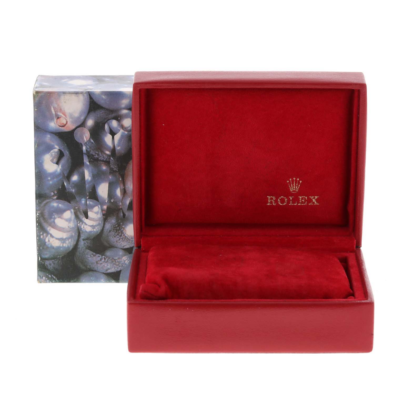 The image shows a Rolex Datejust 79174 Women
s Stainless Steel Silver Dial 79174 Women
s Stainless Steel Silver Dial watch box and cushion from a front angle.