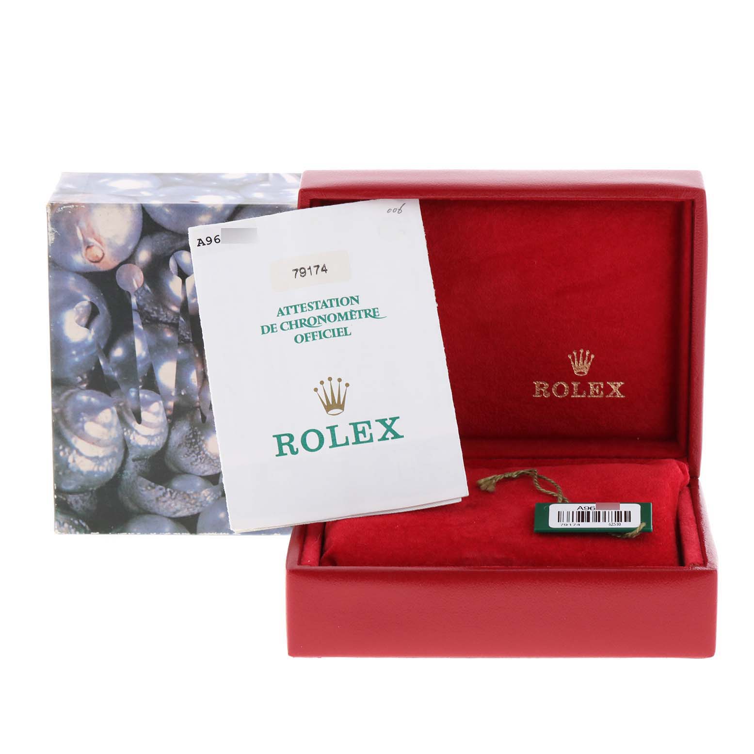 This image shows an open red Rolex box with a manual, tag, and packaging for the Datejust model.