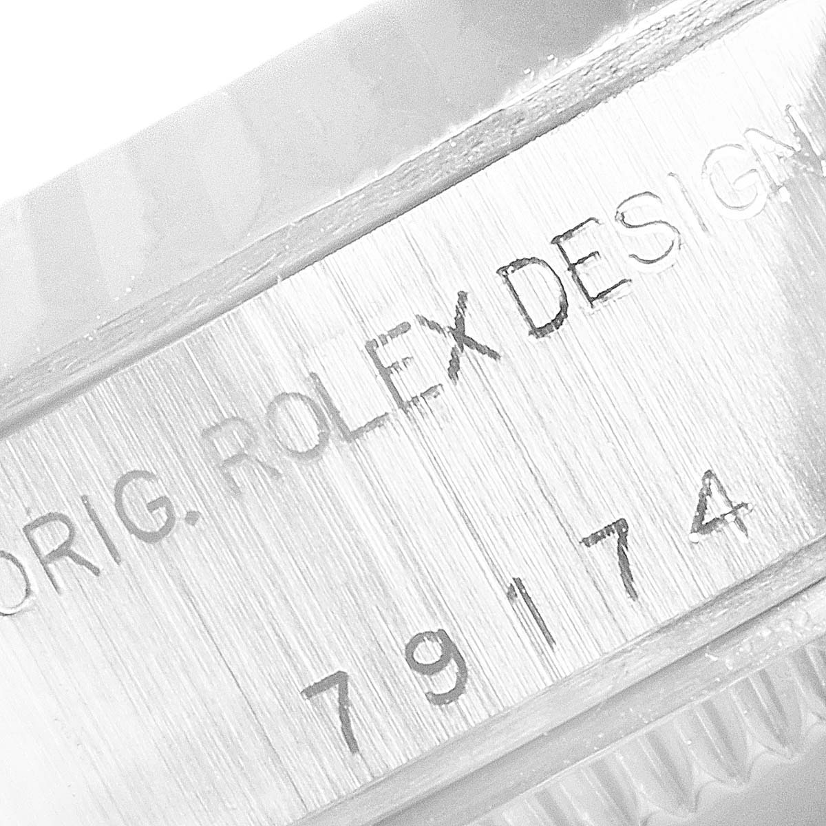 The image shows a close-up of the engraved serial number (79174) on the case side of a Rolex Datejust 79174 Women
s Stainless Steel Silver Dial 79174 Women
s Stainless Steel Silver Dial watch.