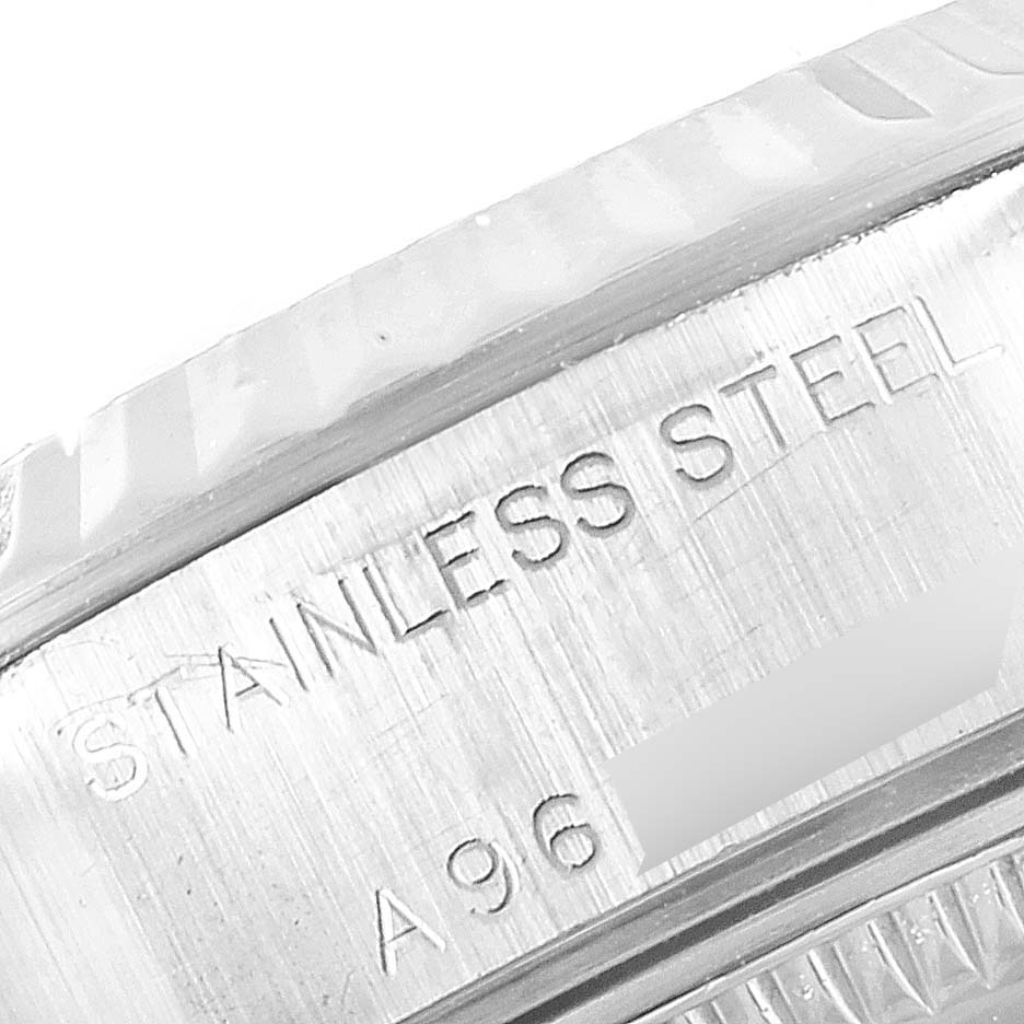 This close-up image shows the engraving on the stainless steel case side of a Rolex Datejust 79174 Women
s Stainless Steel Silver Dial 79174 Women
s Stainless Steel Silver Dial watch.