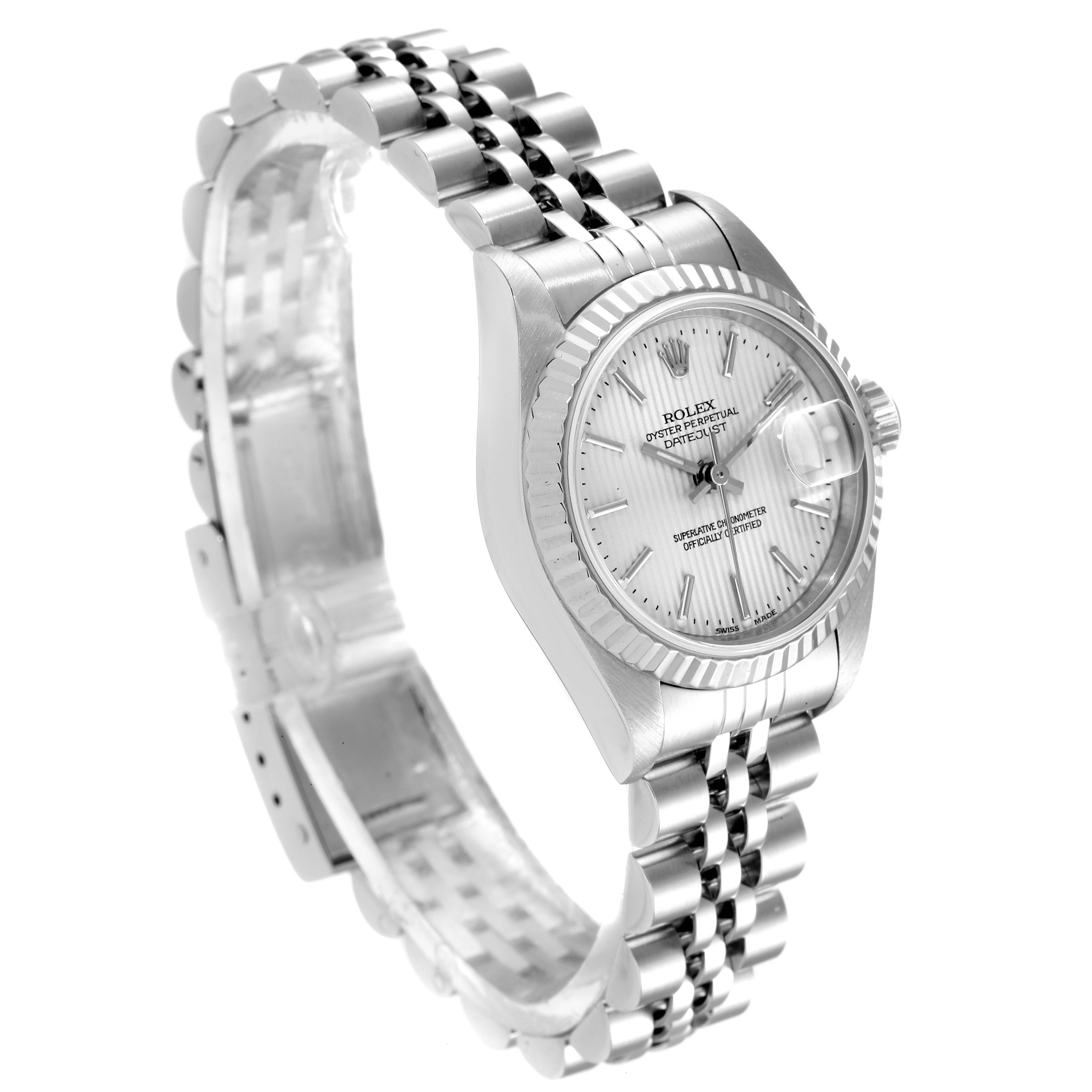 The image shows a Rolex Datejust 79174 Women
s Stainless Steel Silver Dial 79174 Women
s Stainless Steel Silver Dial watch at a slight top angle, highlighting its silver dial, fluted bezel, and jubilee bracelet.