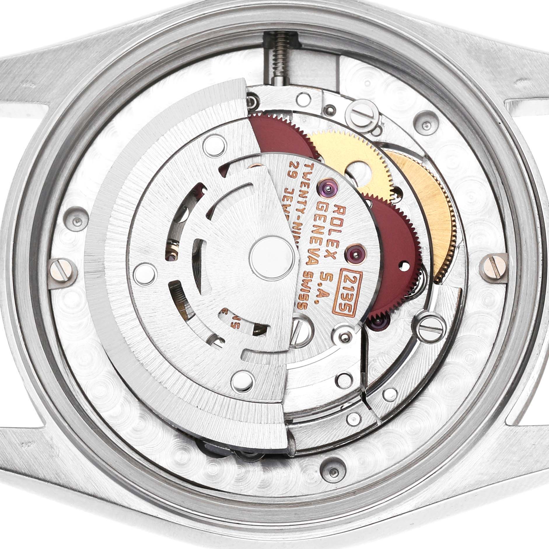 The image shows the movement of a Rolex Mid-Size 68274 Women's Stainless Steel Silver Dial watch, focusing on the intricate internal mechanics.