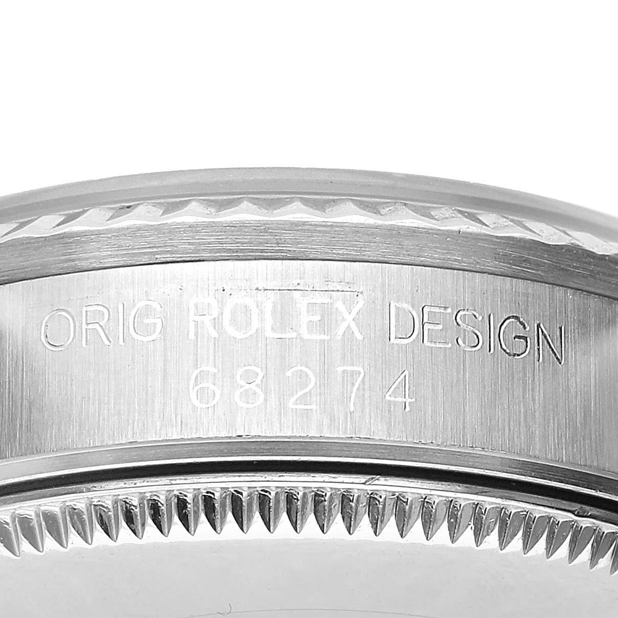 The image shows a close-up of the case side and bezel of a Mid-Size Rolex watch, highlighting the engraved model number.