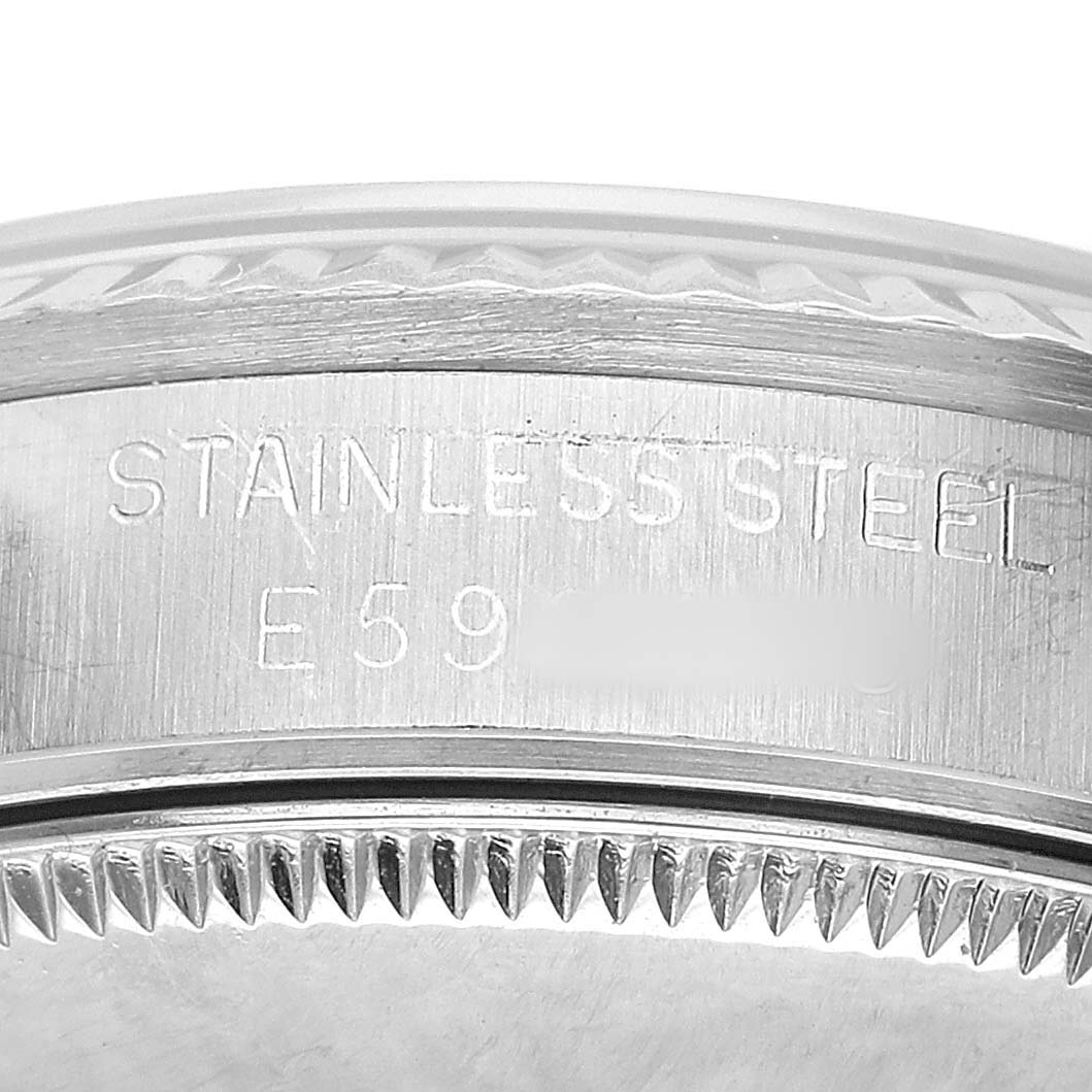 The image shows the case side engraving of a Mid-Size Rolex watch indicating "STAINLESS STEEL."