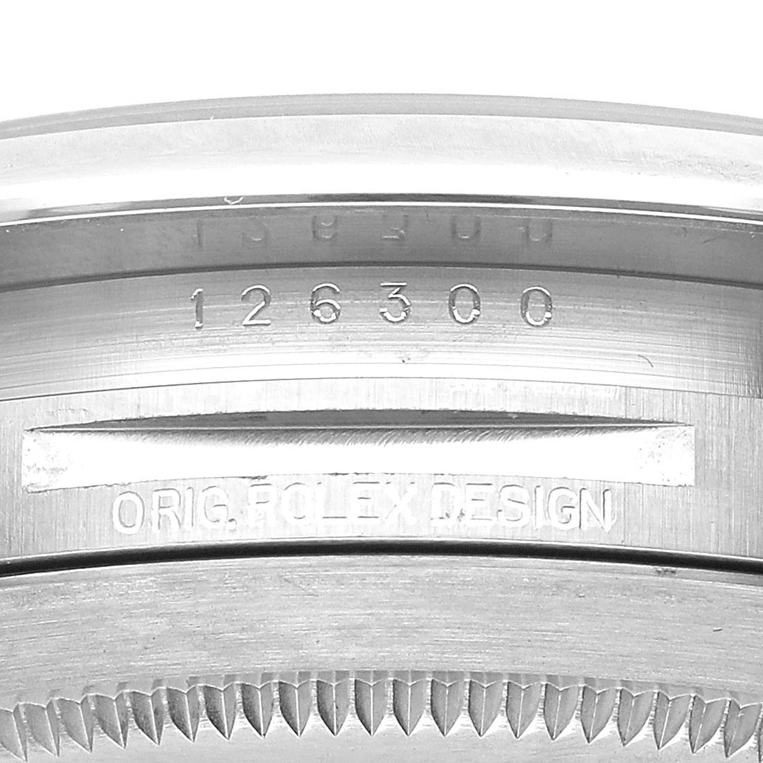 The image shows a close-up of the side of the Rolex Datejust 41 126300 Men's Stainless Steel Grey Dial, highlighting its serial number and "Orig Rolex Design" engraving.