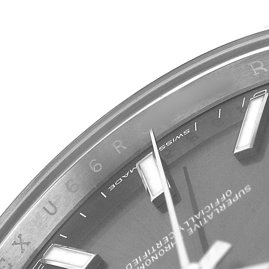 The image shows a close-up angle of the dial and chapter ring of a Rolex Datejust 41 126300 Men's Stainless Steel Grey Dial, highlighting the hands and markers.