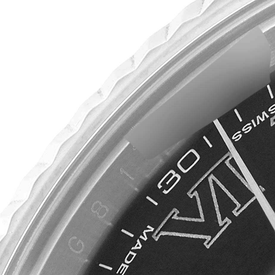 This close-up of the Rolex Datejust 41 116334 Men
s Stainless Steel Grey Dial 116334 Men
s Stainless Steel Grey Dial shows part of the bezel, the dial with "Swiss Made," and a Roman numeral.