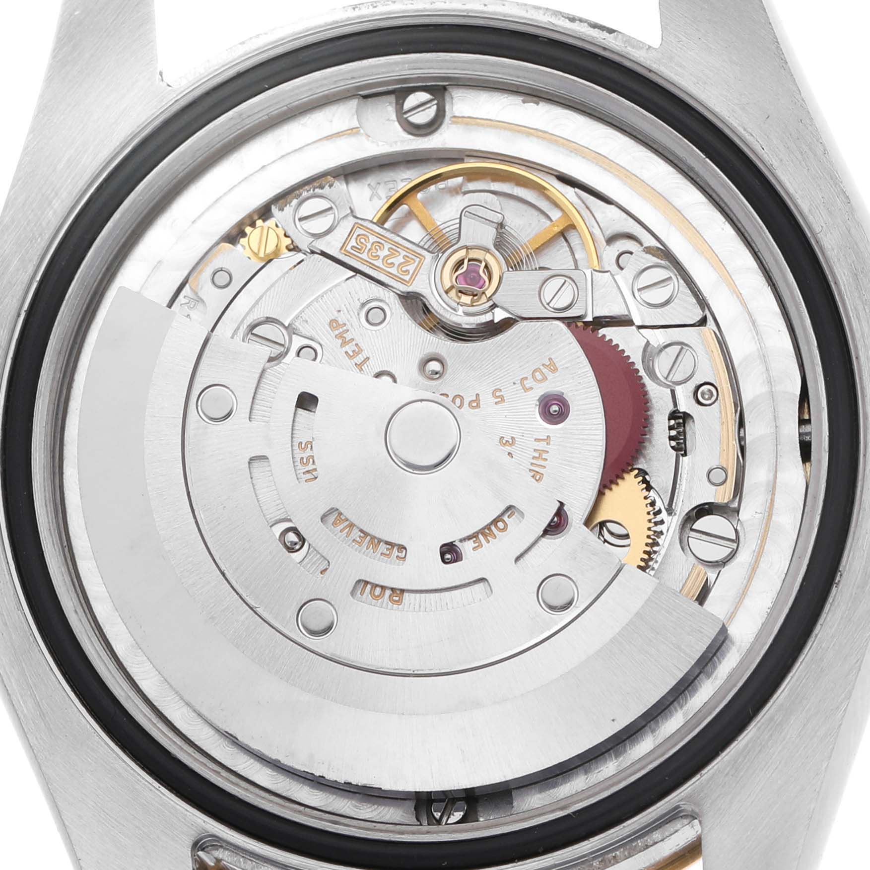 The image shows the movement mechanism of a Rolex Mid-Size 178273 Women's Steel and Gold (two tone) Champagne Dial model watch viewed from the back.