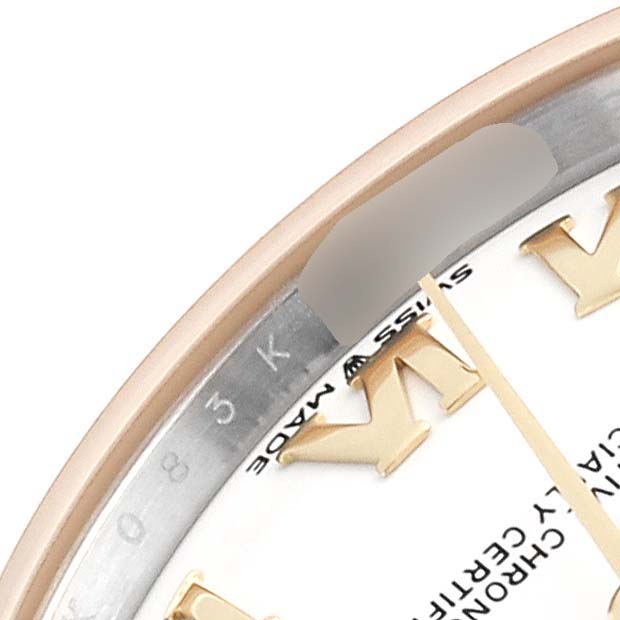 The image shows a partial view of a Rolex Mid-Size 278273 Women's Steel and Gold (two tone) White Dial 278273 Women's Steel and Gold (two tone) White Dial watch dial, focusing on the gold Roman numerals and bezel engraving.