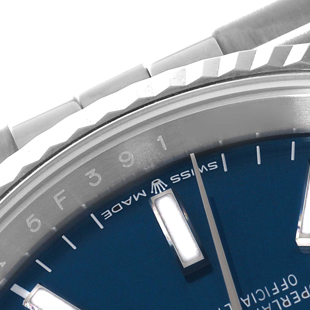 This image shows a close-up of the bezel, bracelet, and part of the dial of a Rolex Datejust 126234 Men's Steel and Gold (two tone)  126234 Men's Steel and Gold (two tone)  watch.