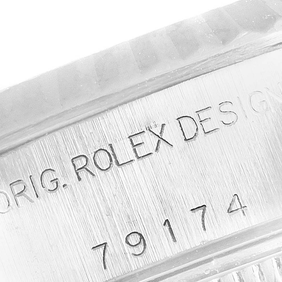 This close-up shows the inner bezel and engraved serial number of the Rolex Datejust 79174 Women
s Stainless Steel Silver Dial 79174 Women
s Stainless Steel Silver Dial watch.