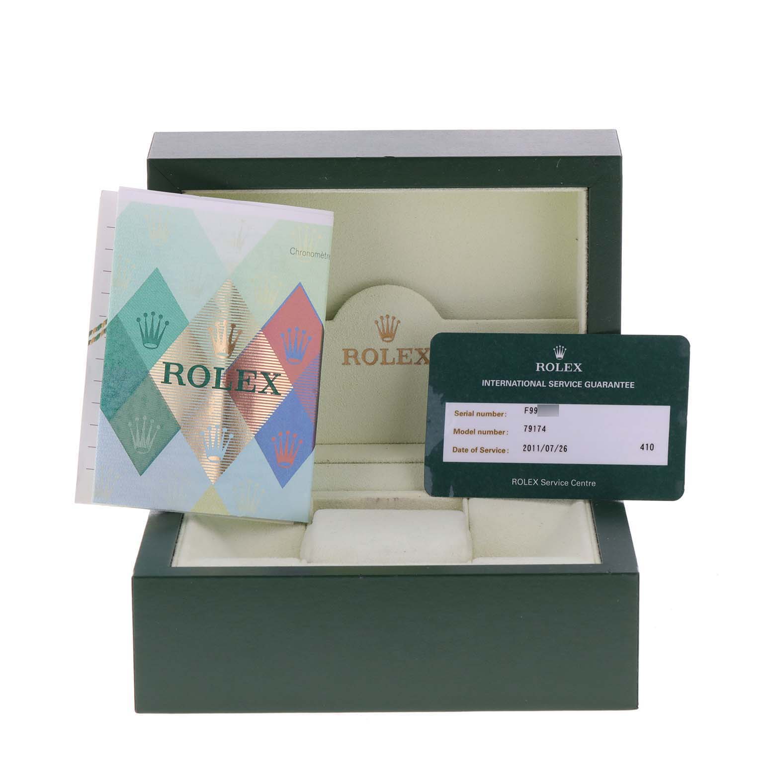 This image shows the open box, guarantee card, and booklet for a Rolex Datejust 79174 Women
s Stainless Steel Silver Dial 79174 Women
s Stainless Steel Silver Dial watch.