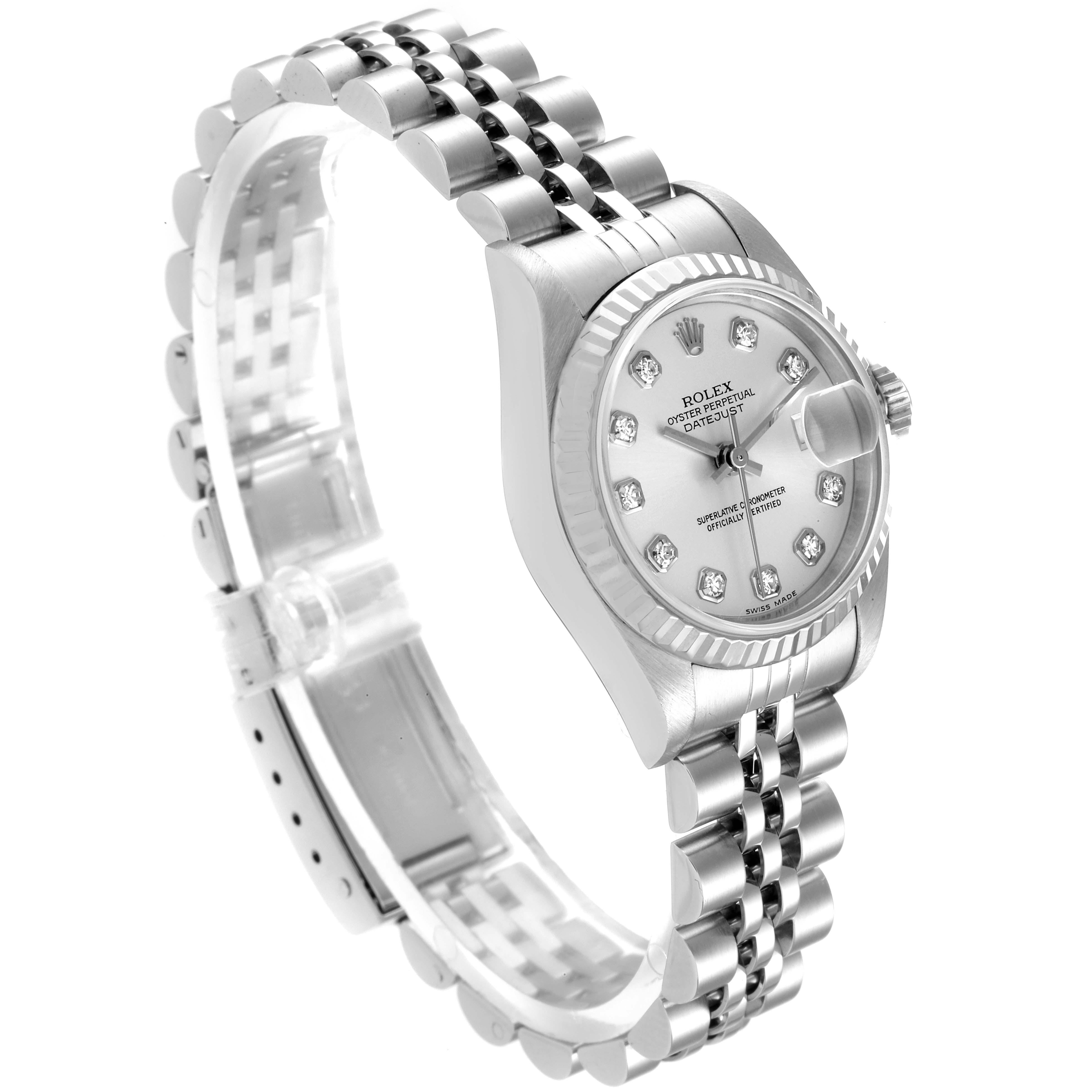 This Rolex Datejust 79174 Women
s Stainless Steel Silver Dial 79174 Women
s Stainless Steel Silver Dial watch is shown at a tilted angle, highlighting the face, fluted bezel, and jubilee bracelet.