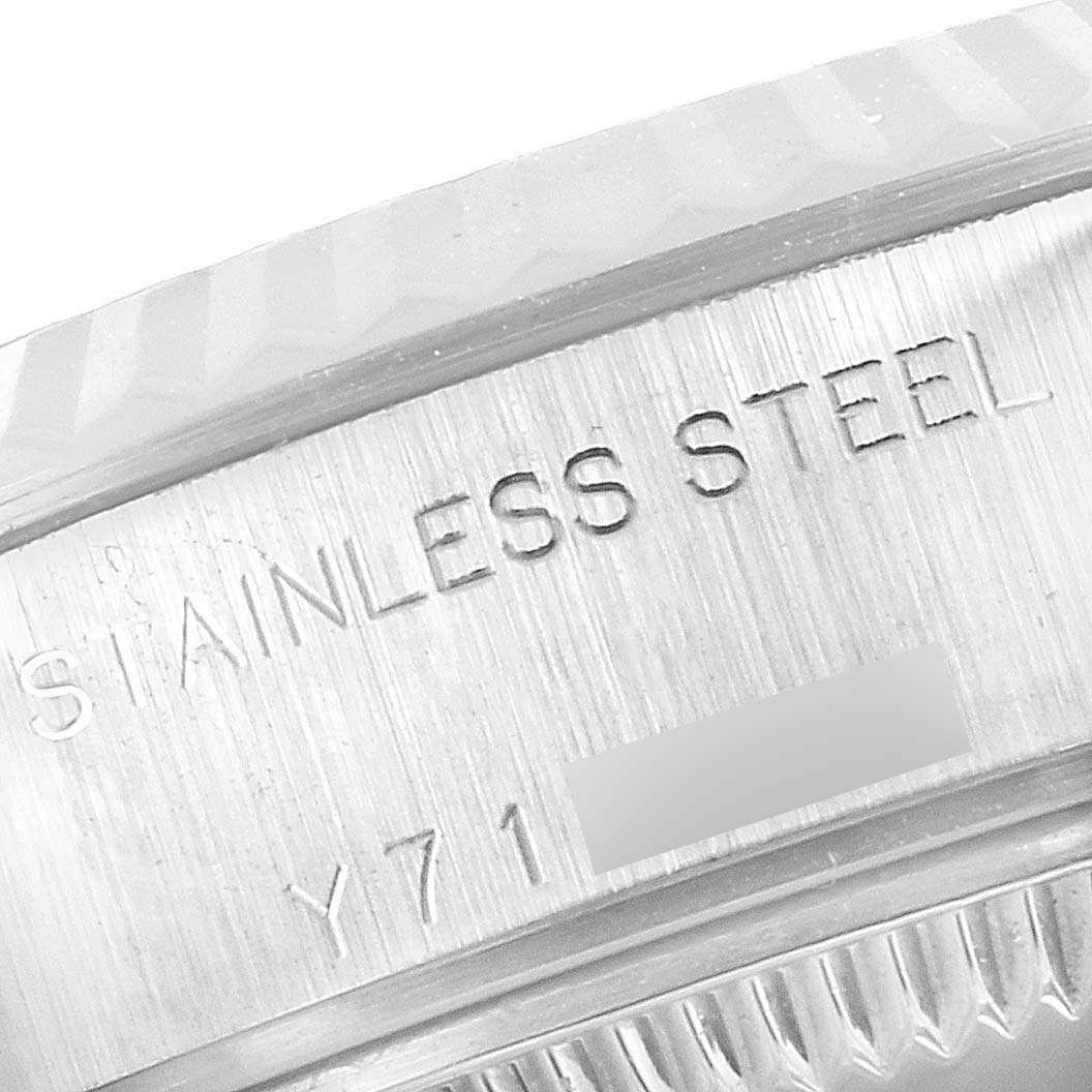 The image shows a close-up of the engraved text "STAINLESS STEEL" on the case side of a Rolex Datejust 79174 Women
s Stainless Steel Silver Dial 79174 Women
s Stainless Steel Silver Dial watch.