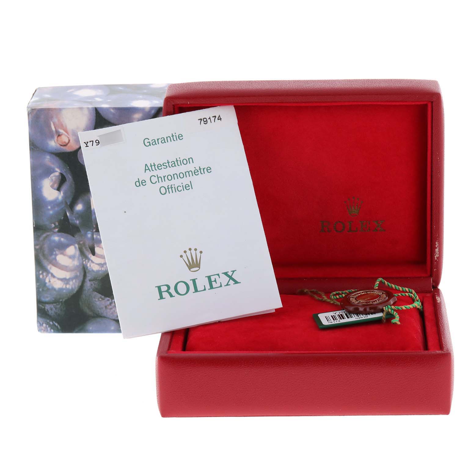 The image shows the packaging and paperwork for a Rolex Datejust 79174 Women
s Stainless Steel Silver Dial 79174 Women
s Stainless Steel Silver Dial model, including a red watch box, a certificate, and a tag.
