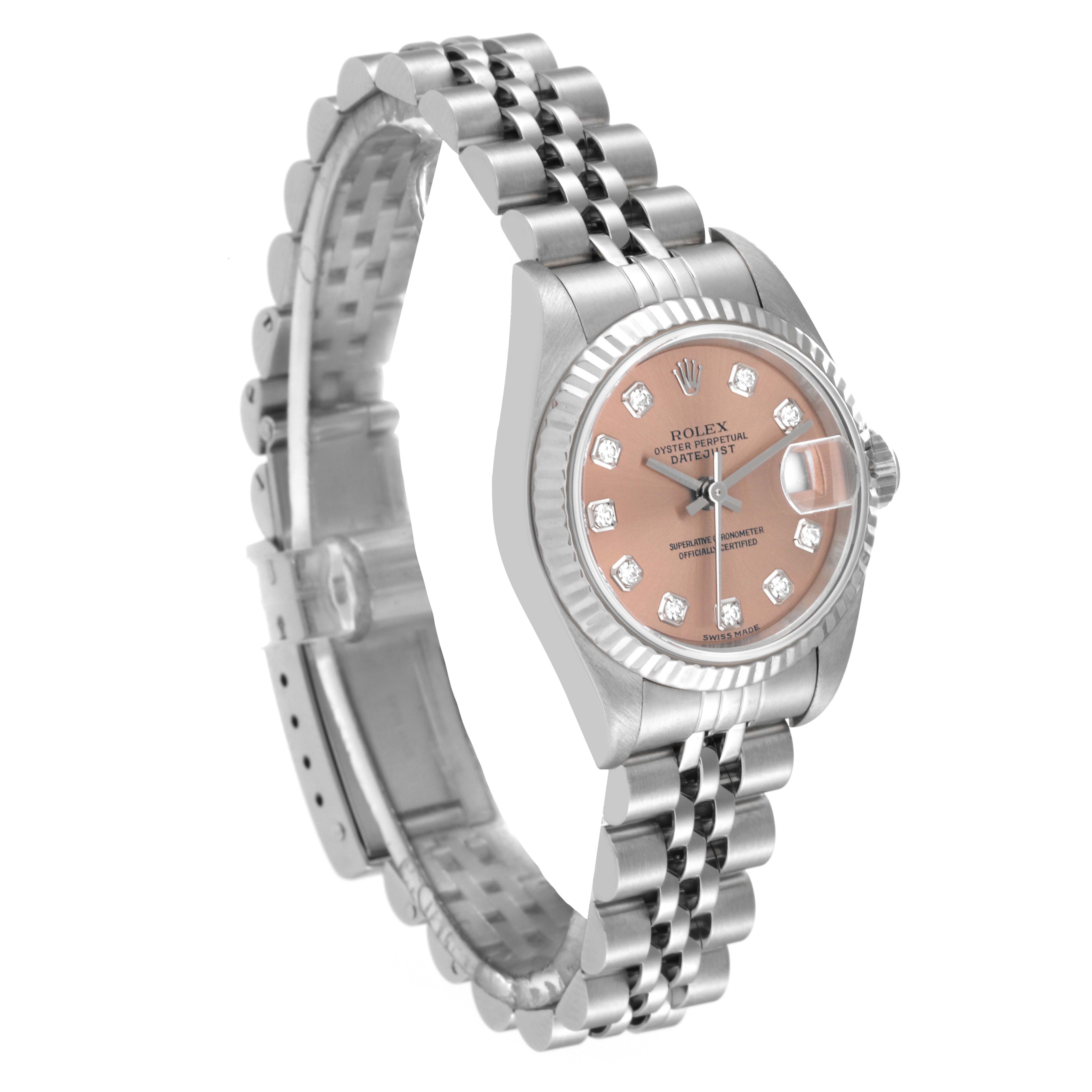 This image shows a Rolex Datejust 79174 Women's Stainless Steel Pink Dial 79174 Women's Stainless Steel Pink Dial watch with a rose dial, diamond hour markers, and a Jubilee bracelet at a front-side angle.