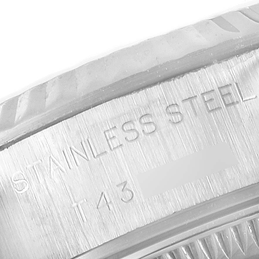 This image shows a close-up of the stainless steel casing on a Rolex Datejust 69174 Women
s Stainless Steel Silver Dial 69174 Women
s Stainless Steel Silver Dial watch.