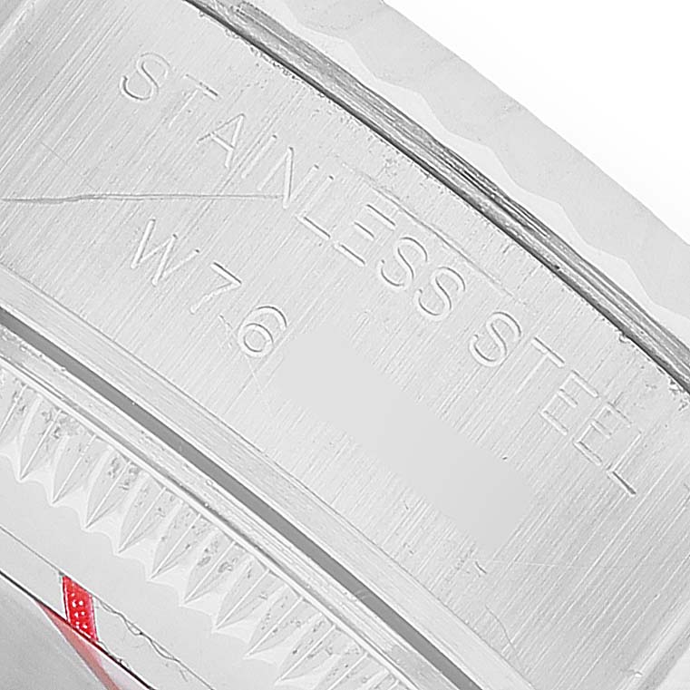 The image shows a close-up of the case edge of a Rolex Datejust 69174 Women's Stainless Steel Silver Dial, featuring "STAINLESS STEEL" engraving.