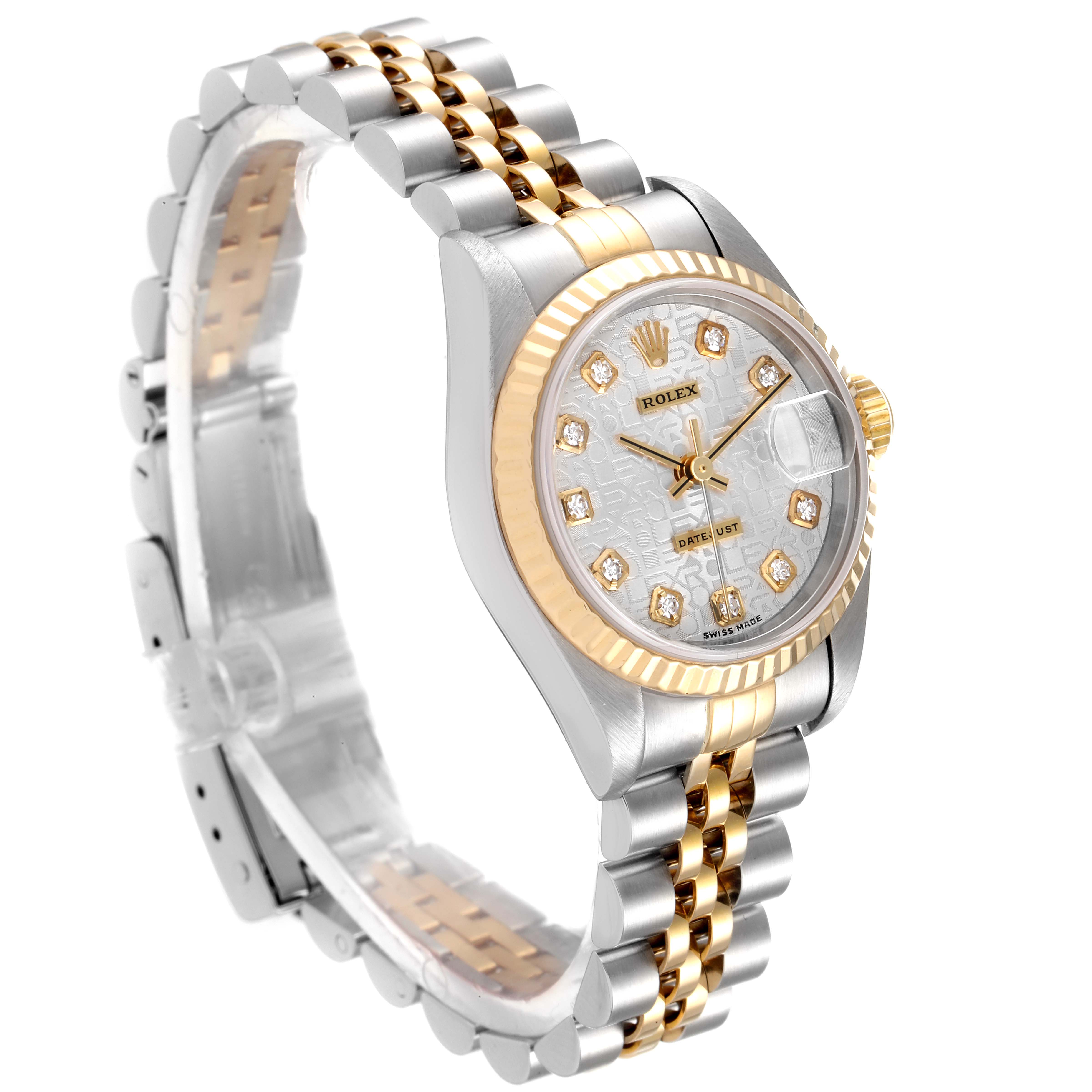 The image shows a Rolex Datejust 79173 Women
s Steel and Gold (two tone) Silver Dial 79173 Women
s Steel and Gold (two tone) Silver Dial watch at a three-quarter angle, highlighting its gold and silver bracelet and diamond-accented face.