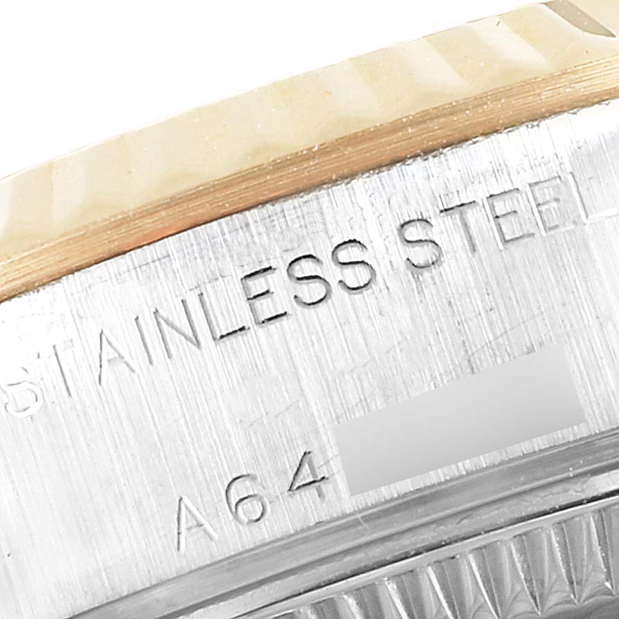 This image shows a close-up of the side of a Rolex Datejust 79173 Women
s Steel and Gold (two tone) Silver Dial 79173 Women
s Steel and Gold (two tone) Silver Dial model, highlighting the "STAINLESS STEEL" engraving.