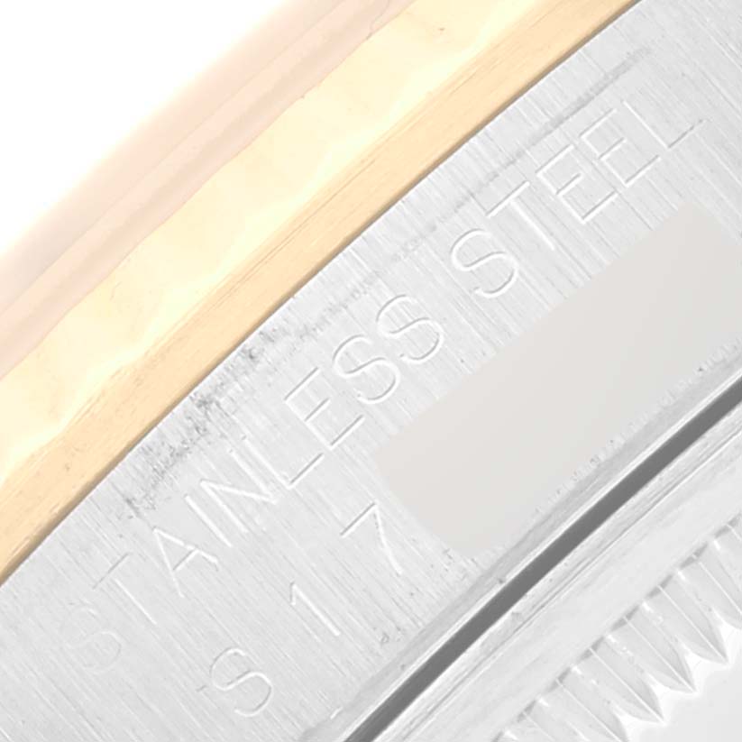 This close-up shows the stainless steel and gold details of the Rolex Datejust 16233 Men's Steel and Gold (two tone) Champagne Dial 16233 Men's Steel and Gold (two tone) Champagne Dial watch.