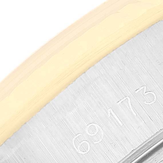 This close-up image shows the engraved model number on the side of the casing for a Rolex Datejust 69173 Women's Steel and Gold (two tone) Champagne Dial 69173 Women's Steel and Gold (two tone) Champagne Dial watch.