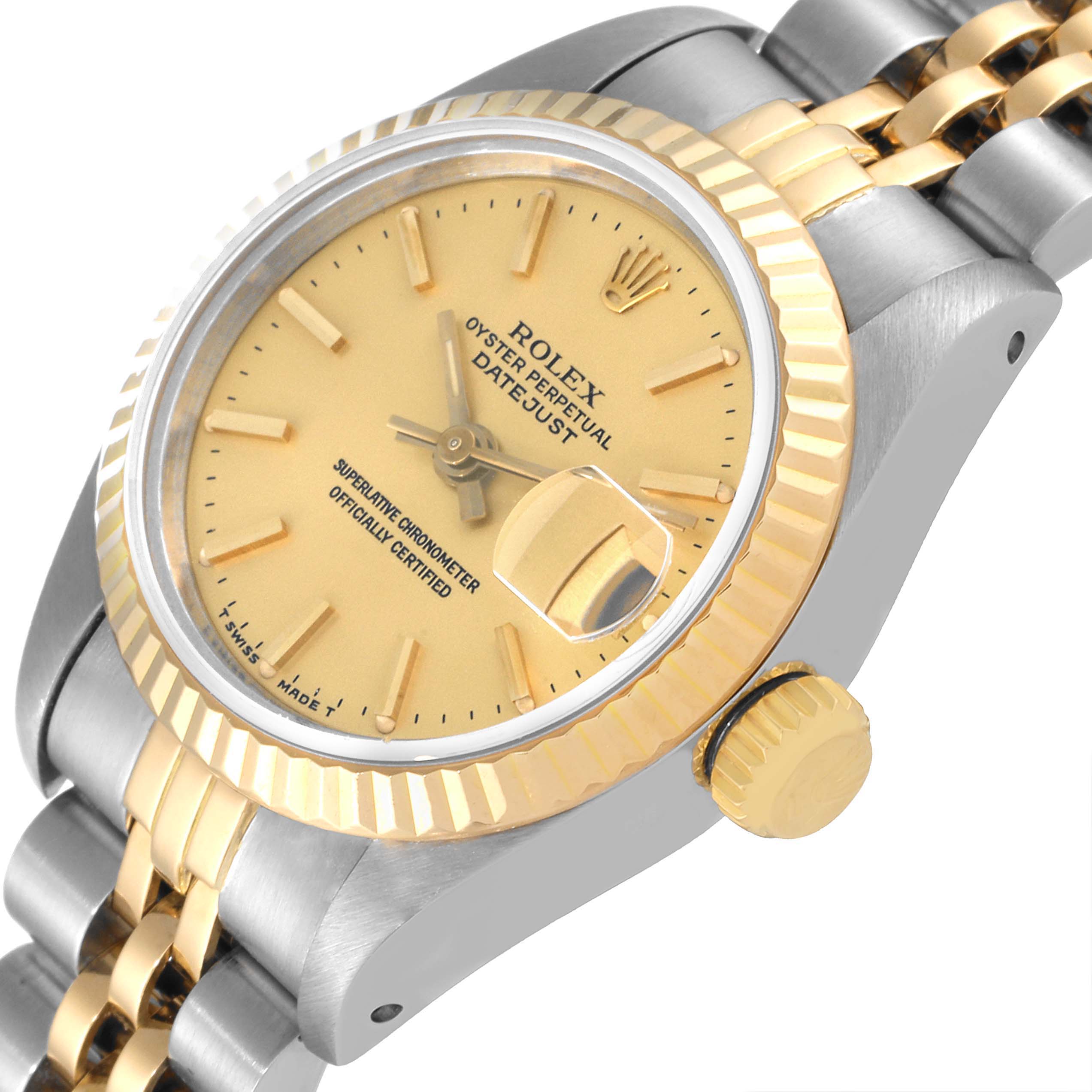 The Rolex Datejust 69173 Women's Steel and Gold (two tone) Champagne Dial 69173 Women's Steel and Gold (two tone) Champagne Dial watch is shown at an angle highlighting the dial, fluted bezel, crown, and part of the two-tone bracelet.
