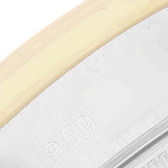 This image shows a close-up angle of the bezel and part of the case of a Rolex Datejust 69173 Women's Steel and Gold (two tone) Champagne Dial 69173 Women's Steel and Gold (two tone) Champagne Dial watch.