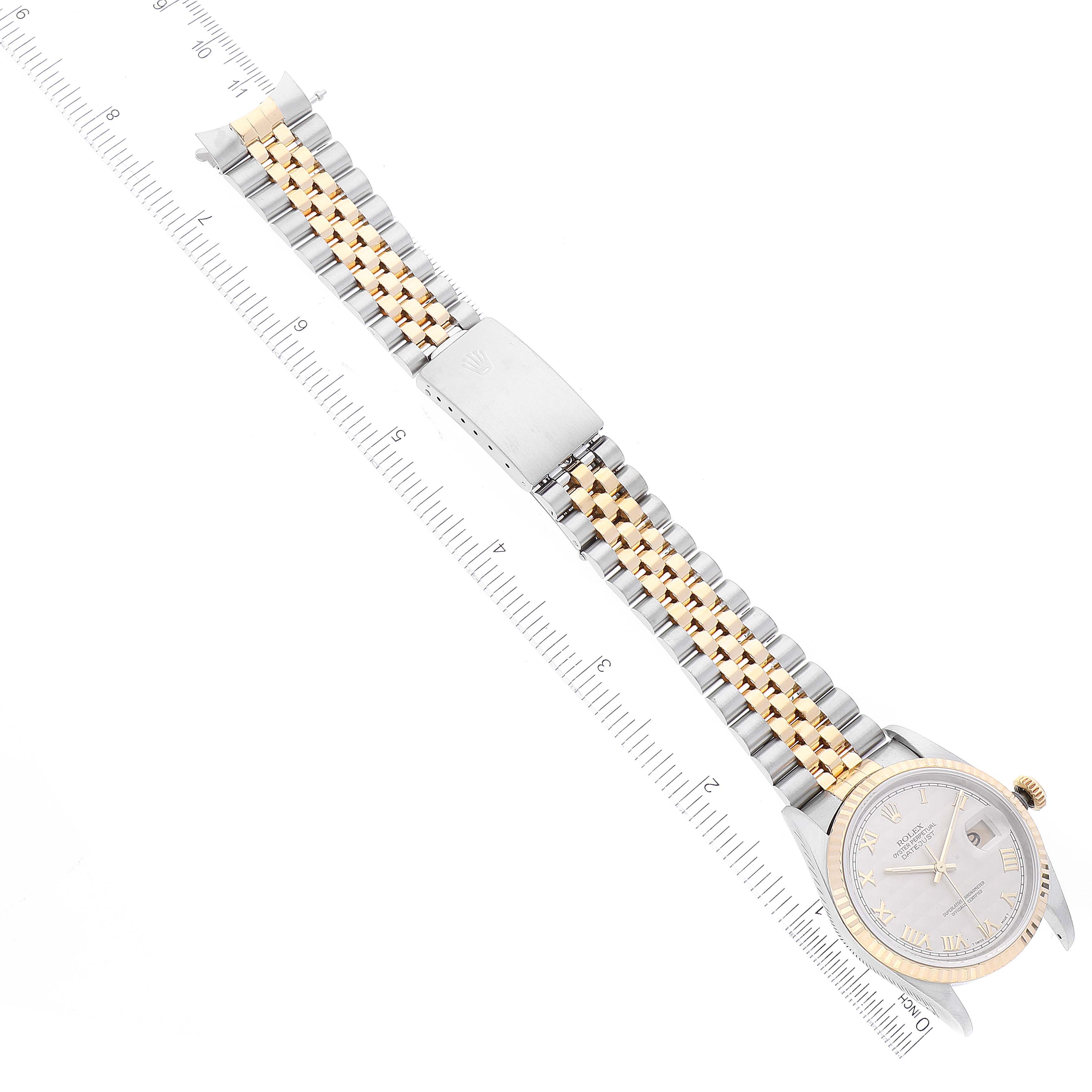 The image shows the Rolex Datejust 16233 Men's Steel and Gold (two tone) Beige Dial 16233 Men's Steel and Gold (two tone) Beige Dial watch laid flat, showcasing its dial, bracelet, and clasp, with a ruler below for scale.