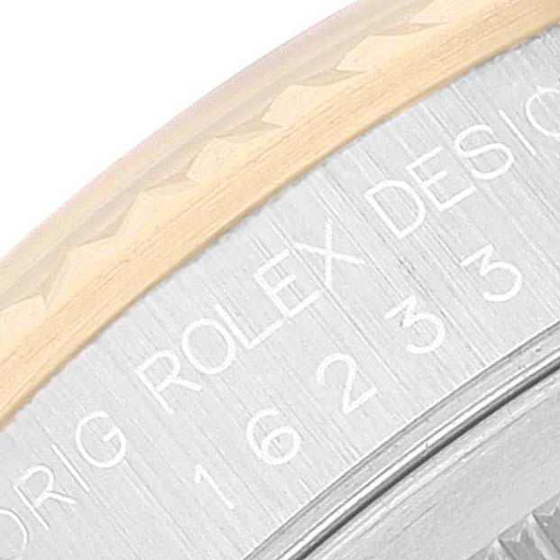 The image shows a close-up of the etched text and bezel on a Rolex Datejust 16233 Men's Steel and Gold (two tone) Beige Dial 16233 Men's Steel and Gold (two tone) Beige Dial watch.