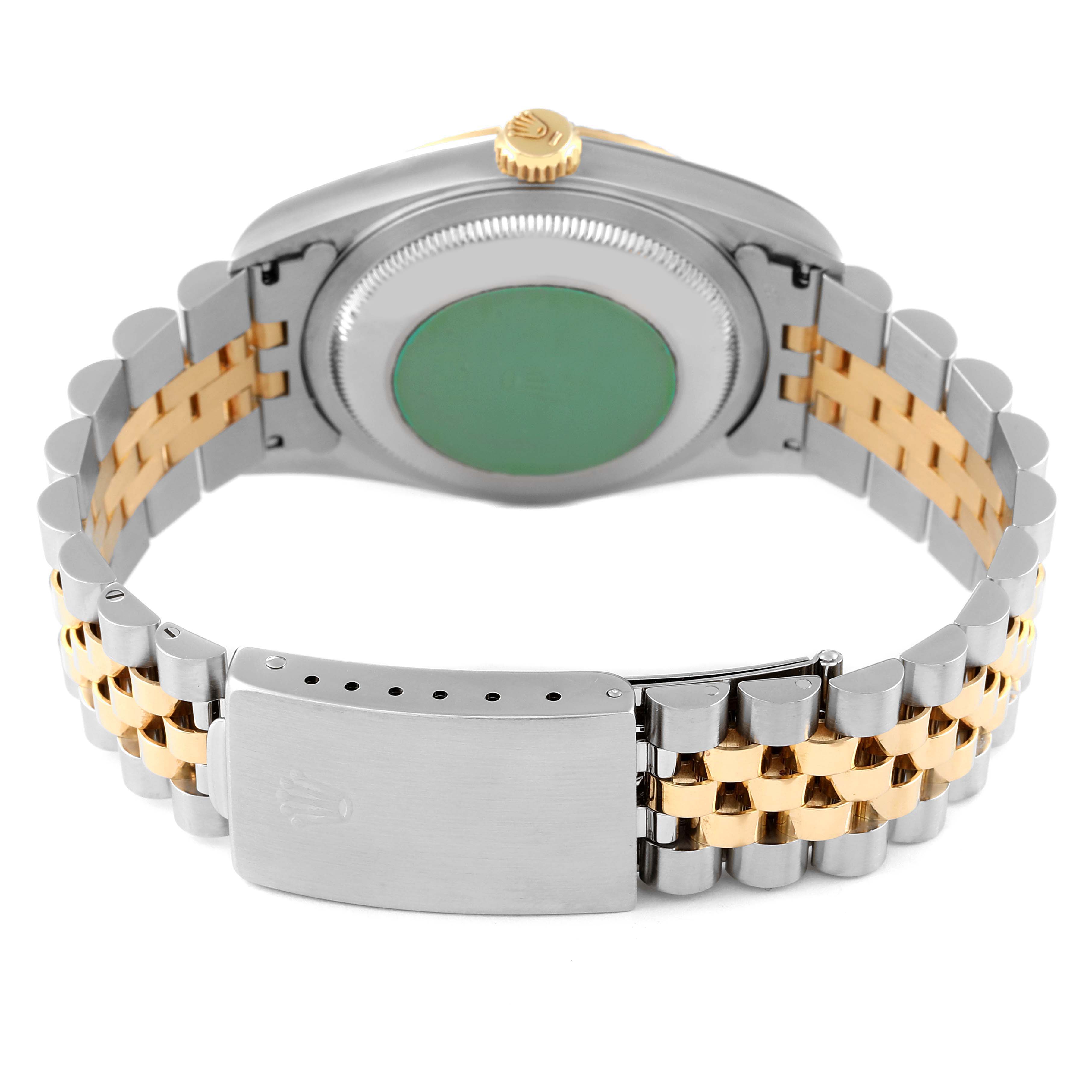 This image shows the Datejust model by Rolex from the back, highlighting the bracelet, clasp, case back, and crown.