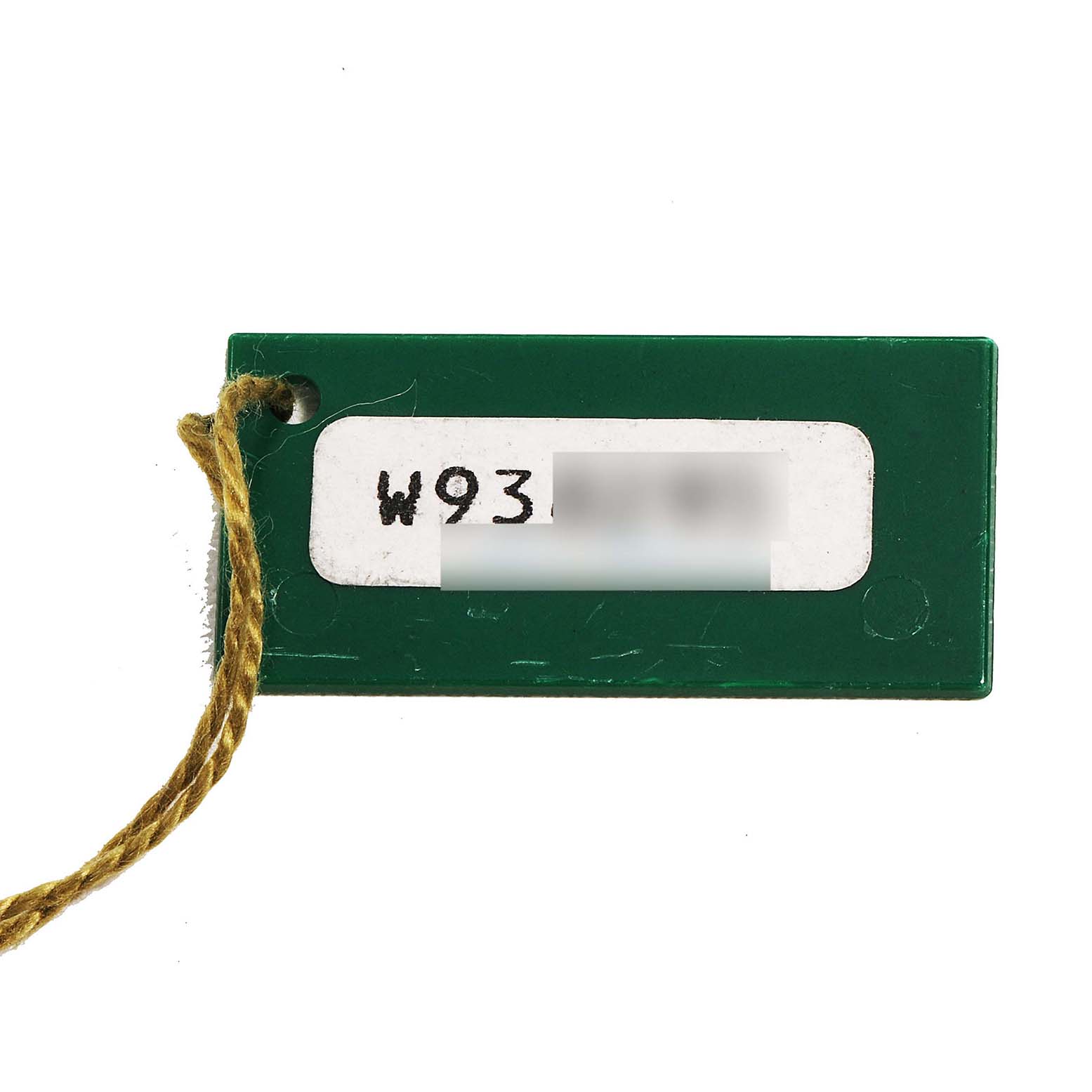 The image shows a green tag with a string, likely associated with a Rolex Datejust 69173 Women's Steel and Gold (two tone) White Dial watch.