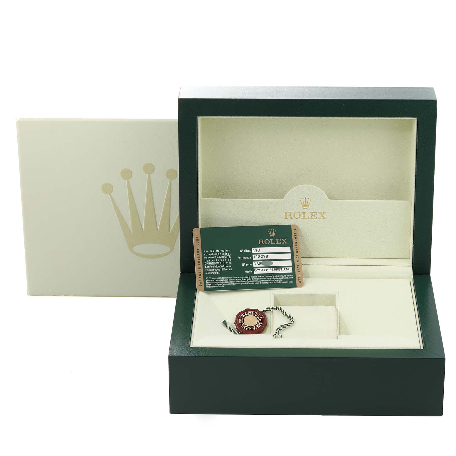 The image shows the packaging and authentication card for a Rolex President 118239 Men's White Gold Black Dial 118239 Men's White Gold Black Dial model watch, including a green box and a tag.