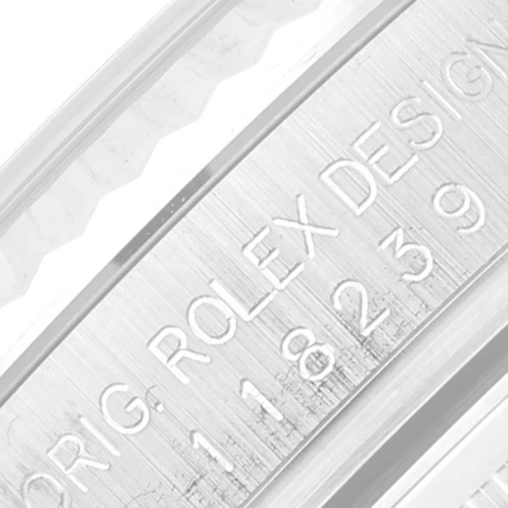 This image shows a close-up of the engraving on the inner case of a Rolex President 118239 Men's White Gold Black Dial 118239 Men's White Gold Black Dial model watch.