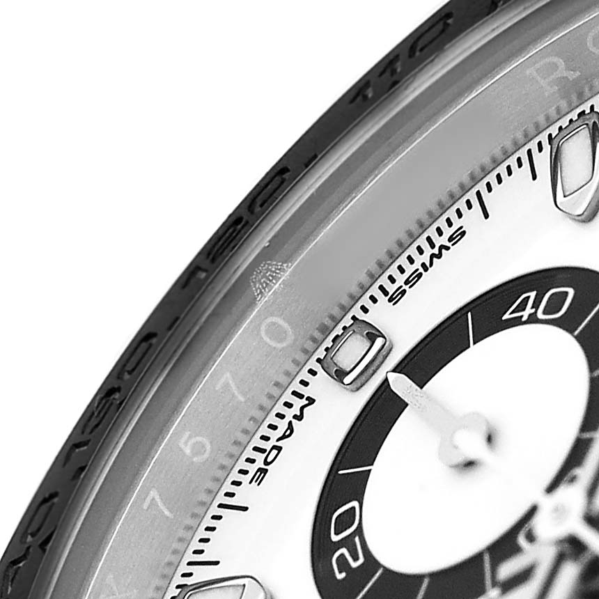 The image shows a close-up of the dial and outer bezel of a Rolex Daytona M116500LN-0001 Men's Stainless Steel White Dial watch.