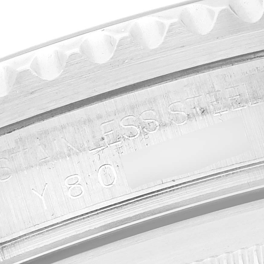 This image shows a close-up view of the knurled bezel and engraved markings on a Rolex GMT-Master 16710 Men
s Stainless Steel Black Dial 16710 Men
s Stainless Steel Black Dial watch.