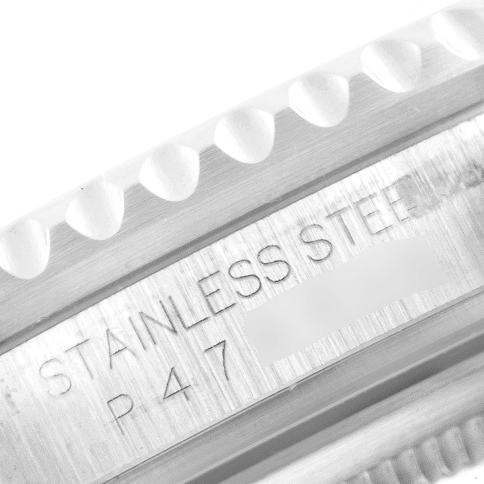 This close-up image shows the side profile of the bezel and the case of a Rolex GMT-Master 16710 Men
s Stainless Steel Black Dial 16710 Men
s Stainless Steel Black Dial watch, revealing the "Stainless Steel" engraving.